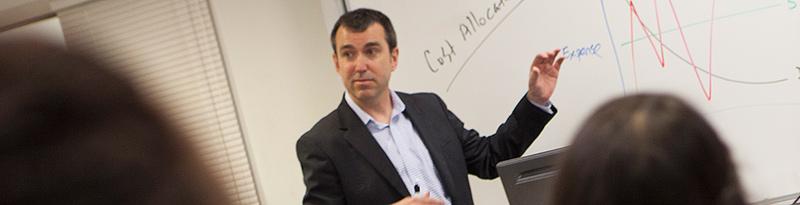 Photo of professor Chris Burnley teaching a class