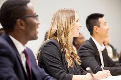 Three management students in class